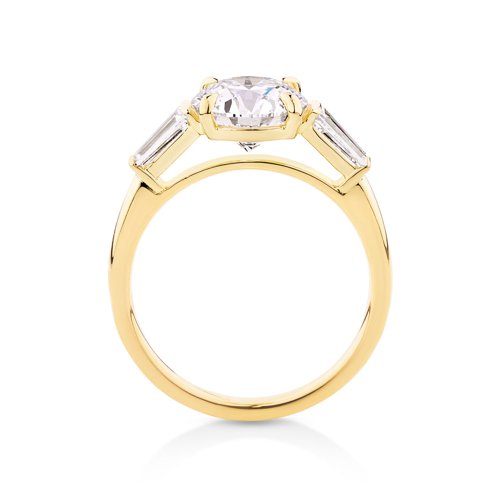 yellow gold brilliant round cut engagement ring with tappered baguette side diamonds Miranda Kerr style ring. Can be made with lab grown or natural diamonds. Custom made engagement rings sunshine coast, Buderim