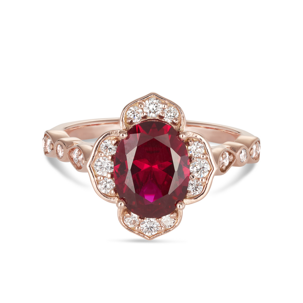 14ct rose gold custom made ruby flower engagement ring featuring an oval cut red ruby in a flower setting with lab grown round diamonds and a diamond band. This is a unique vintage inspired engagement ring with a coloured stone. Our rings are designed at our Sunshine Coast Jeweller located in Buderim and are All Australian made, beautiful, engagement rings.