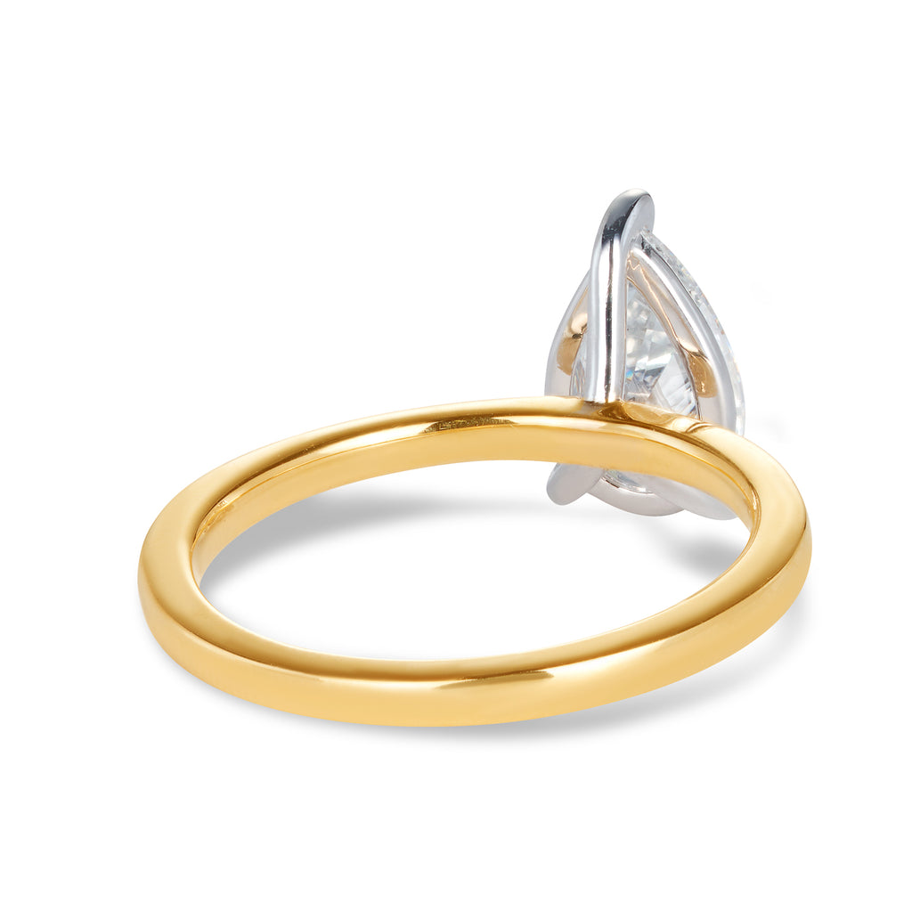 14ct yellow gold custom made engagement ring featuring a pear cut lab grown, cultured, diamond set in a 14ct white gold setting with 3 claws. All Australian made engagement ring. Sunshine Coast Jeweller located in Buderim for your custom made beautiful engagement rings