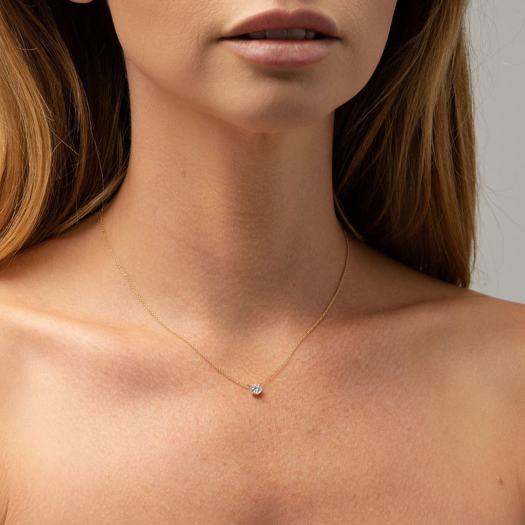 Image of necklace on model. 18ct Yellow Gold Delicate Necklace with a Four Claw Set .50ct Brilliant Round Cultured Diamond. Sunshine Coast Jewellery Store custom made pieces