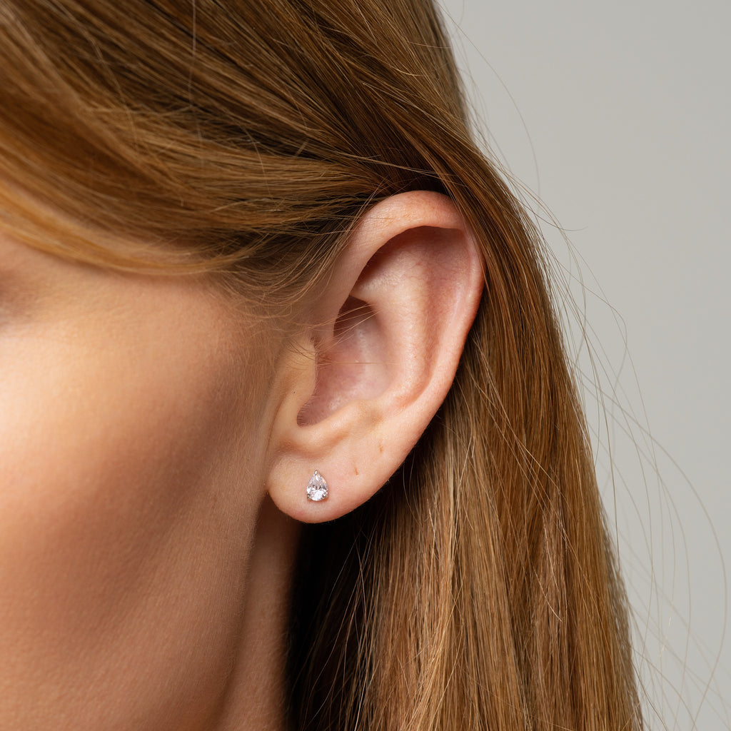 image of pear cut cz studs in yellow gold sunshine coast on model