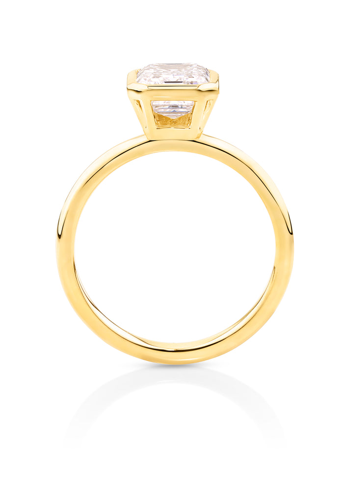 yellow gold bezel set emerald cut diamond engagement ring set in a modern bezel setting. This beautiful engagement ring can be made with lab grown or natural diamonds. Custom made engagement rings sunshine coast, Buderim