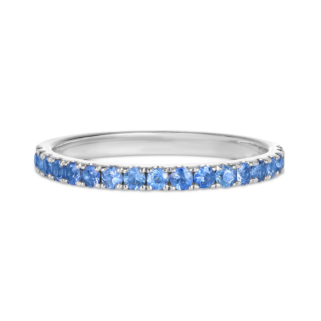 white gold weddng band or stacker ring with blue gemstones