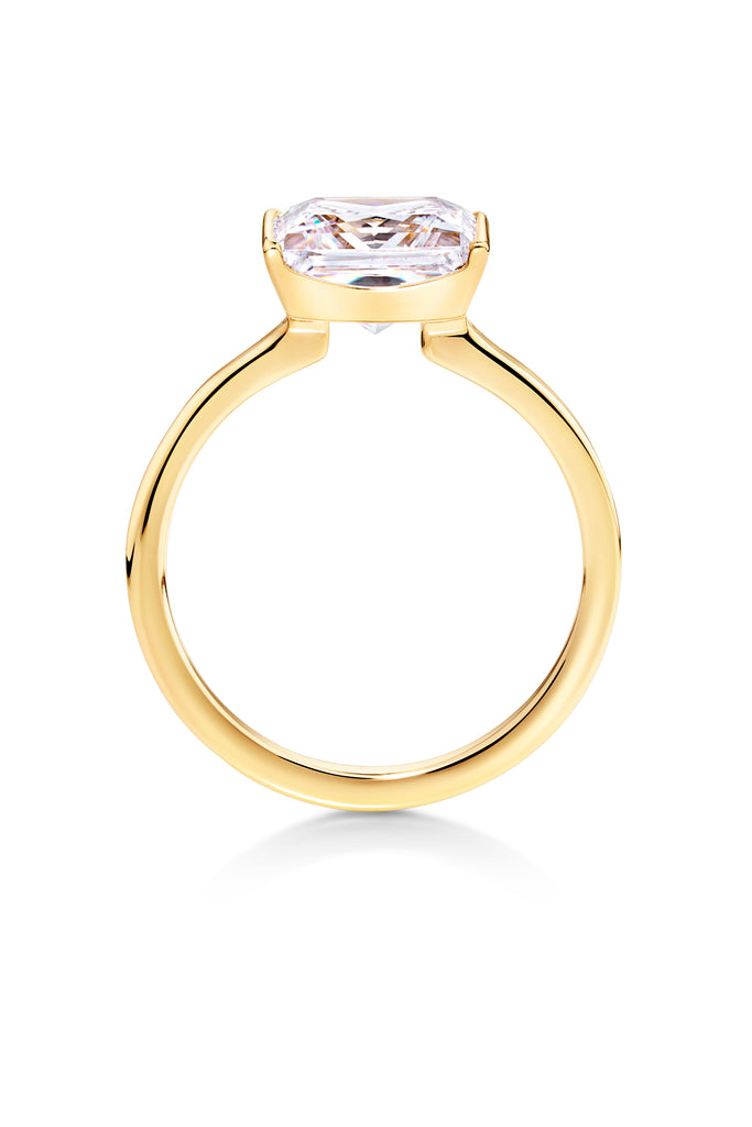 Asscher cut diamond engagement ring half bezel setting in yellow gold.