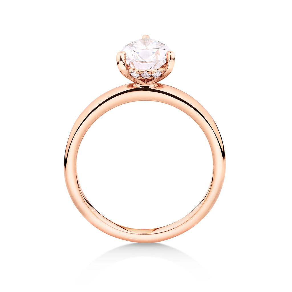 Side view of an 18ct rose gold solitaire engagement ring featuring a 2ct pear cut lab grown, cultured, diamond set in a petite 3 claw setting. This beautiful engagement ring can be made with lab grown or natural diamonds. Custom made engagement rings sunshine coast, Buderim. Australian made engagement rings