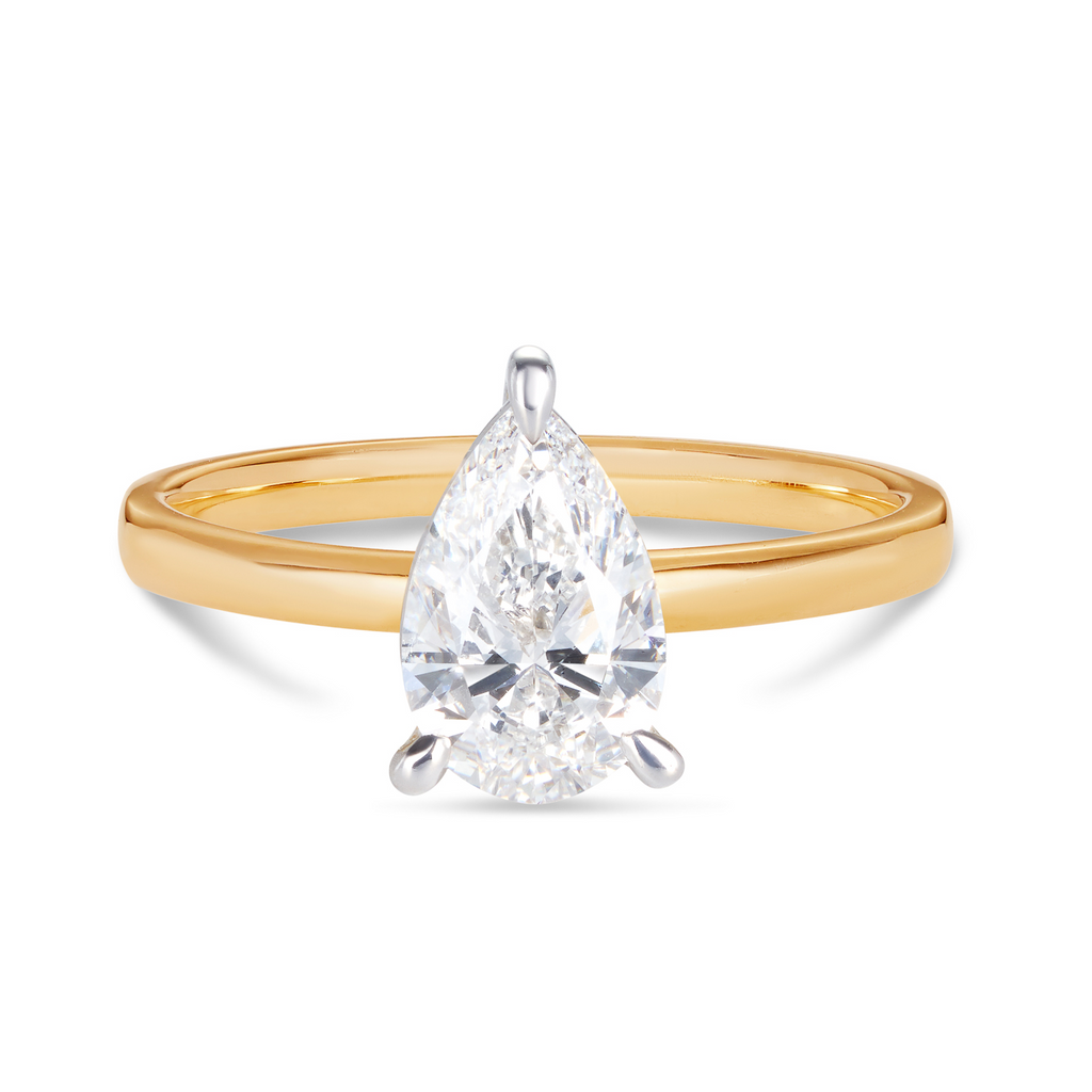 14ct yellow gold custom made engagement ring featuring a pear cut lab grown, cultured, diamond set in a 14ct white gold setting with 3 claws. All Australian made engagement ring. Sunshine Coast Jeweller located in Buderim for your custom made beautiful engagement rings