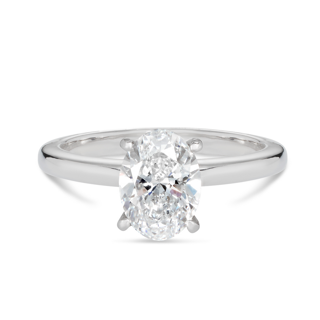 18ct white gold custom made solitaire engagement ring featuring a 1.50ct oval cut lab grown, cultured, diamond, in a 4 claw setting. Our rings are designed at our Sunshine Coast Jeweller located in Buderim and are All Australian made, beautiful, engagement rings.