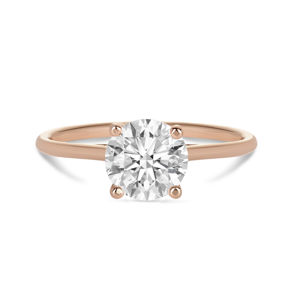 18ct rose gold engagement ring with a brilliant round diamond in a petite 4 claw setting and delicate band. Sunshine Coast jeweller, Morgan & Co, custom make engagement rings 