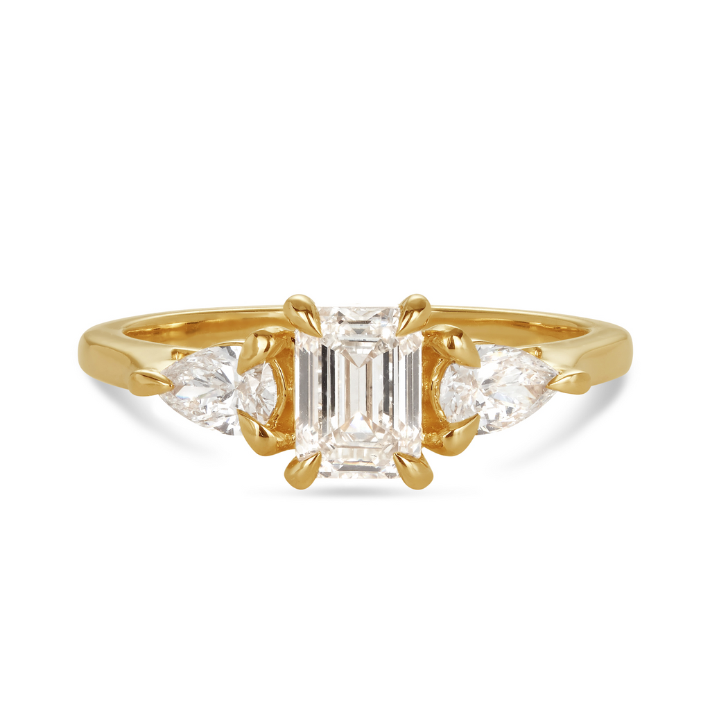 Emerald cut trilogy ring yellow gold deals