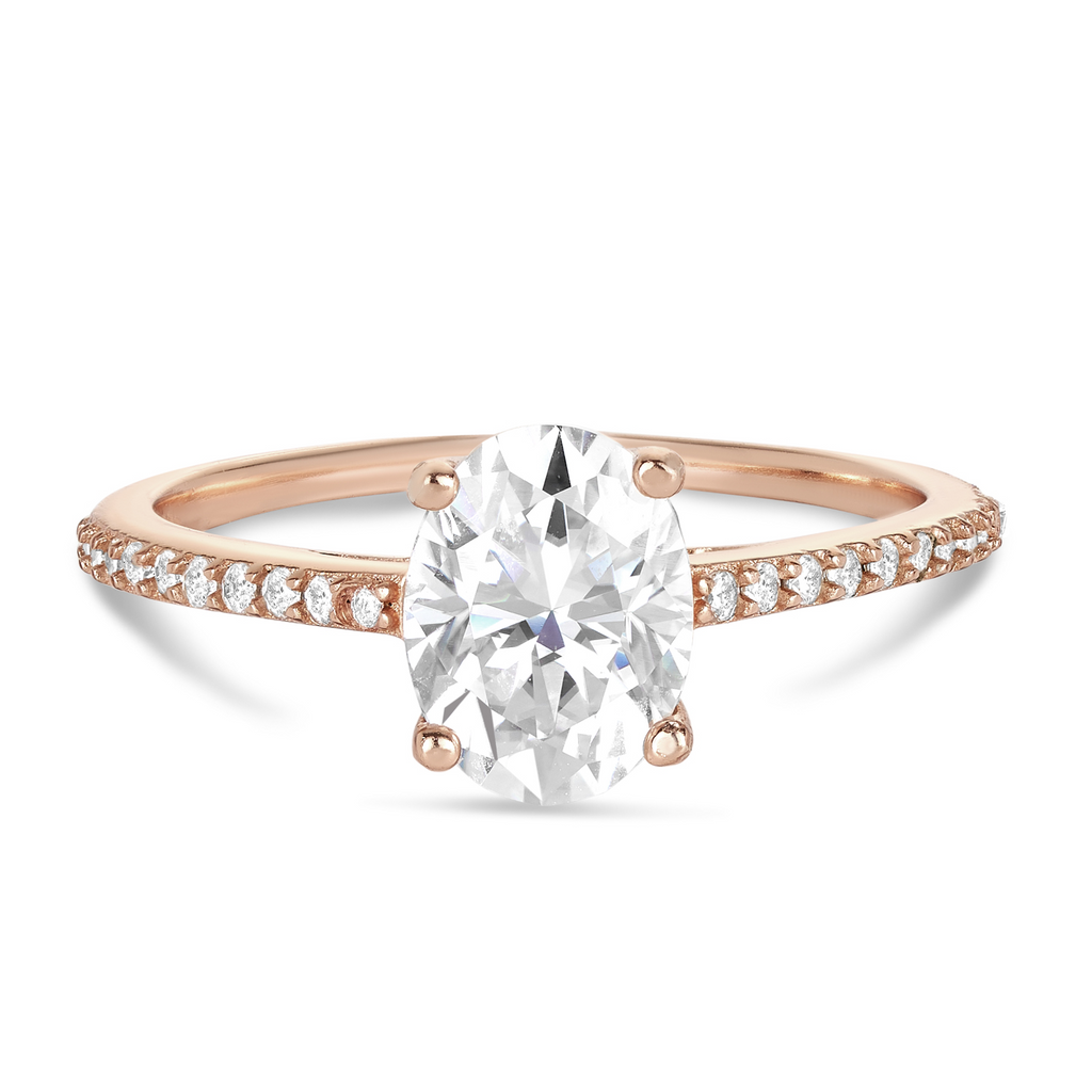 rose gold engagement ring with oval diamond and diamond band in delicate setting. Sunshine Coast engagement rings
