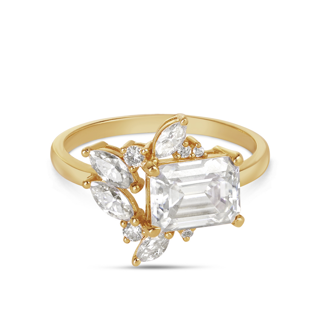 emerald cut stone with marquise diamonds and rounds in this vintage style yellow gold engagement ring. Made by morgan & Co, for your beautiful engagement rings 