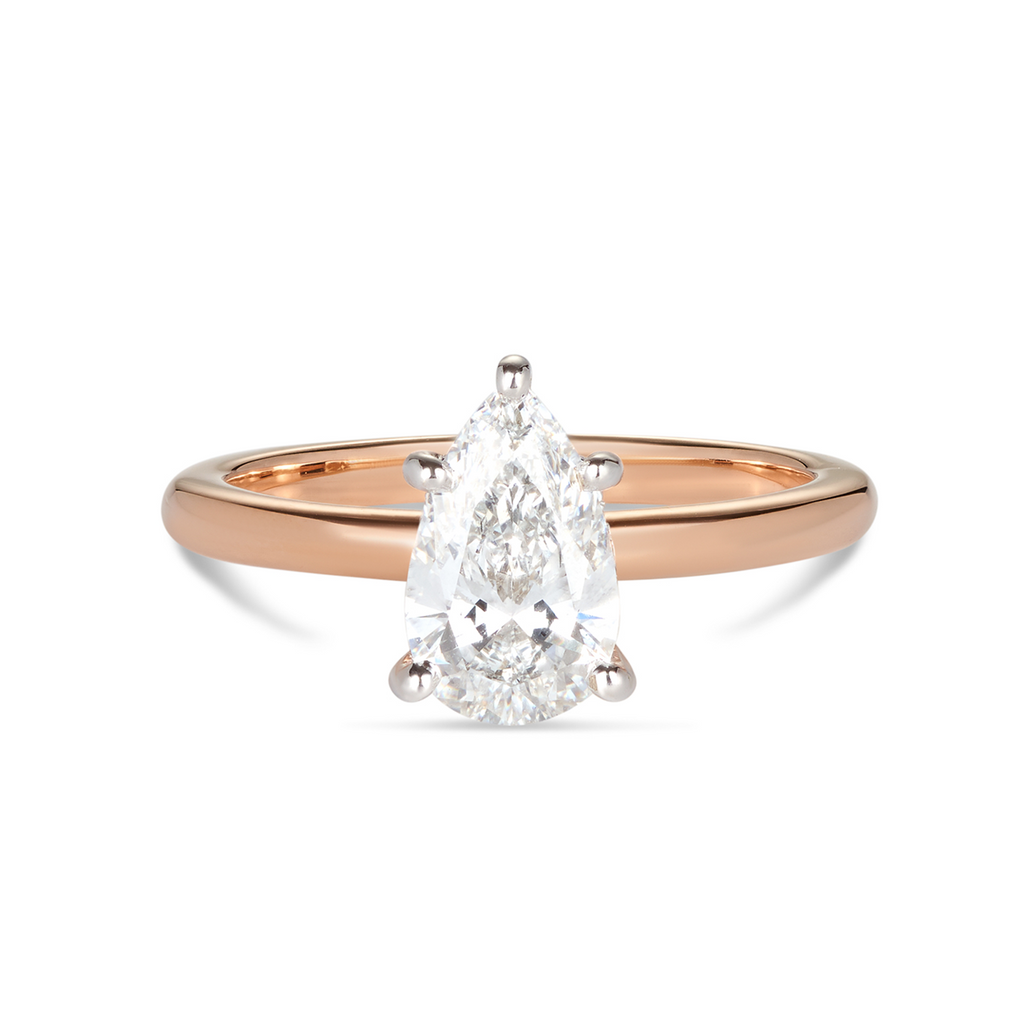 18ct rose gold custom made engagement ring featuring a pear cut lab grown, cultured, diamond set in a petite white gold 6 claw setting. All Australian made engagement ring. Sunshine Coast Jeweller located in Buderim for your custom made beautiful engagement rings