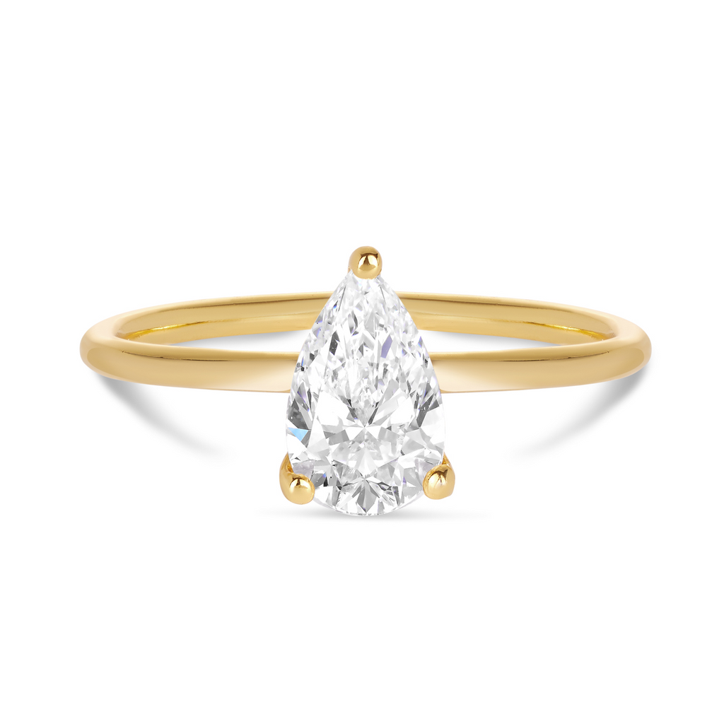 Pear cut diamond in delicate 3 claw setting in yellow gold. Sunshine Coast beautiful engagement rings