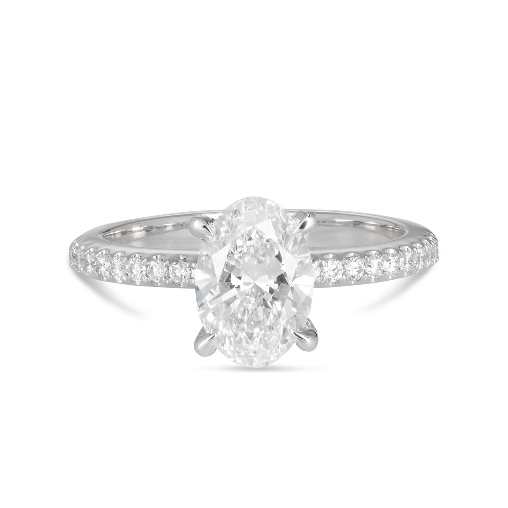 18ct white gold custom made engagement ring featuring a 1.50ct oval cut lab grown, cultured, diamond set in white gold petite 4 claw setting with a pave diamond band. All Australian made engagement ring. Sunshine Coast Jeweller located in Buderim for your custom made beautiful engagement rings