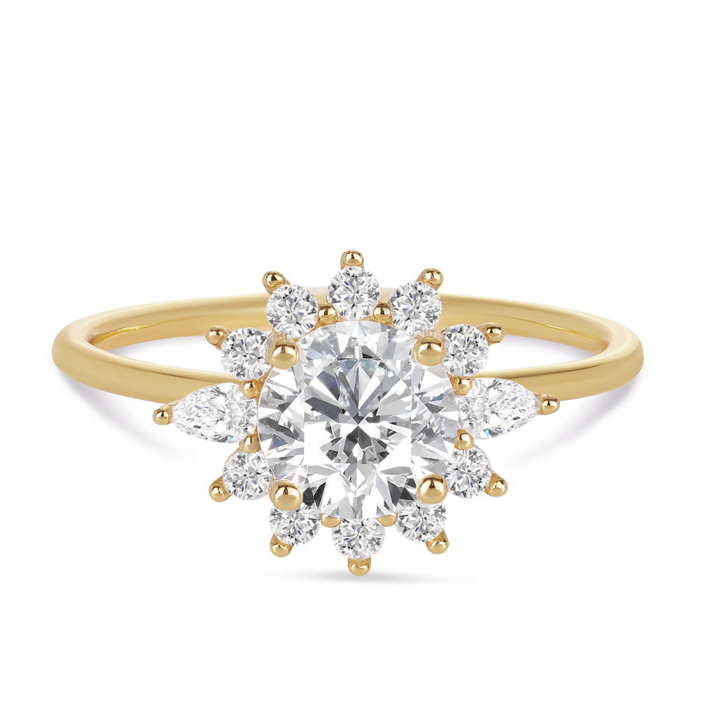 vintage style engagement ring featuring a round diamond with a halo of rounds and pear cut diamonds. contact Morgan & Co, Sunshine Coast Jewellers for your custom engagement ring enquiries 