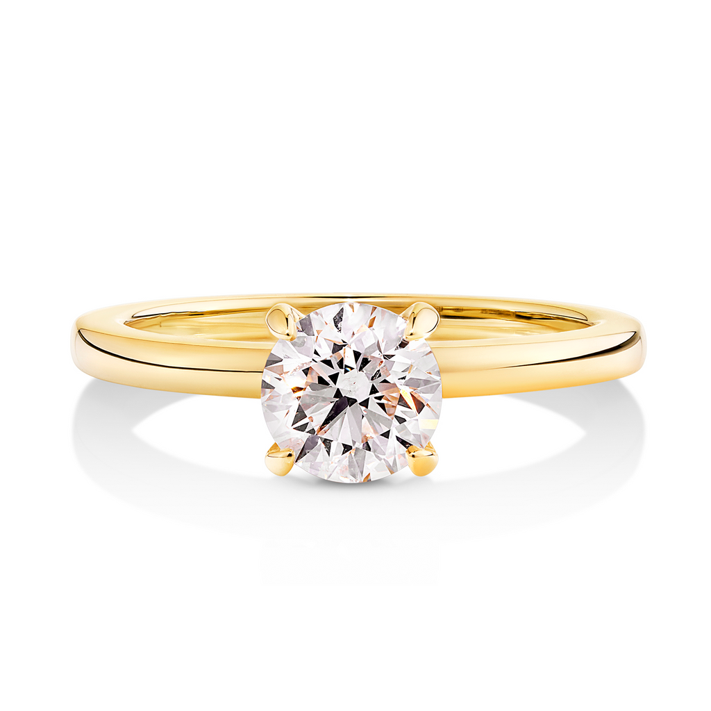 14ct yellow gold solitaire engagement ring featuring a .90ct brilliant round cut natural diamond set in a petite 4 claw setting. This beautiful engagement ring can be made with lab grown or natural diamonds. Custom made engagement rings sunshine coast, Buderim. Australian made engagement rings