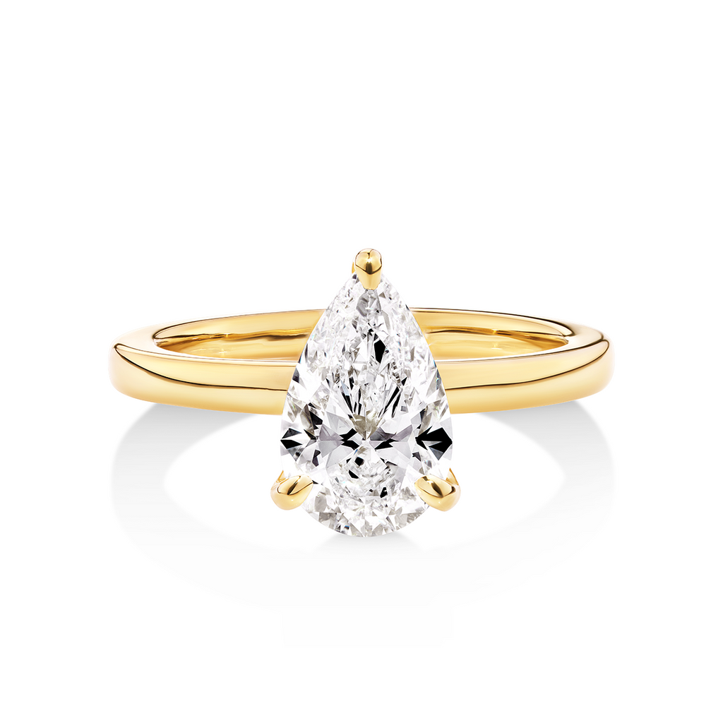 14ct yellow gold solitaire engagement ring featuring a pear cut lab grown, cultured, diamond set in a petite 3 claw setting. This beautiful engagement ring can be made with lab grown or natural diamonds. Custom made engagement rings sunshine coast, Buderim. Australian made engagement rings
