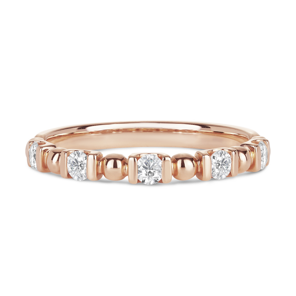 rose gold wedding band featuring round balls of gold between round diamonds. unique and beautiful engagement rings sunshine coast