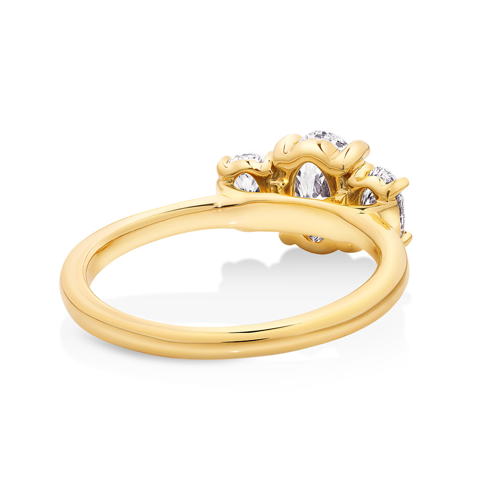 14ct yellow gold trilogy oval cut diamond engagement ring featuring 3 oval lab grown diamonds set in petite claw setting. This beautiful engagement ring can be made with lab grown or natural diamonds. Custom made engagement rings sunshine coast, Buderim. Australian made engagement rings 