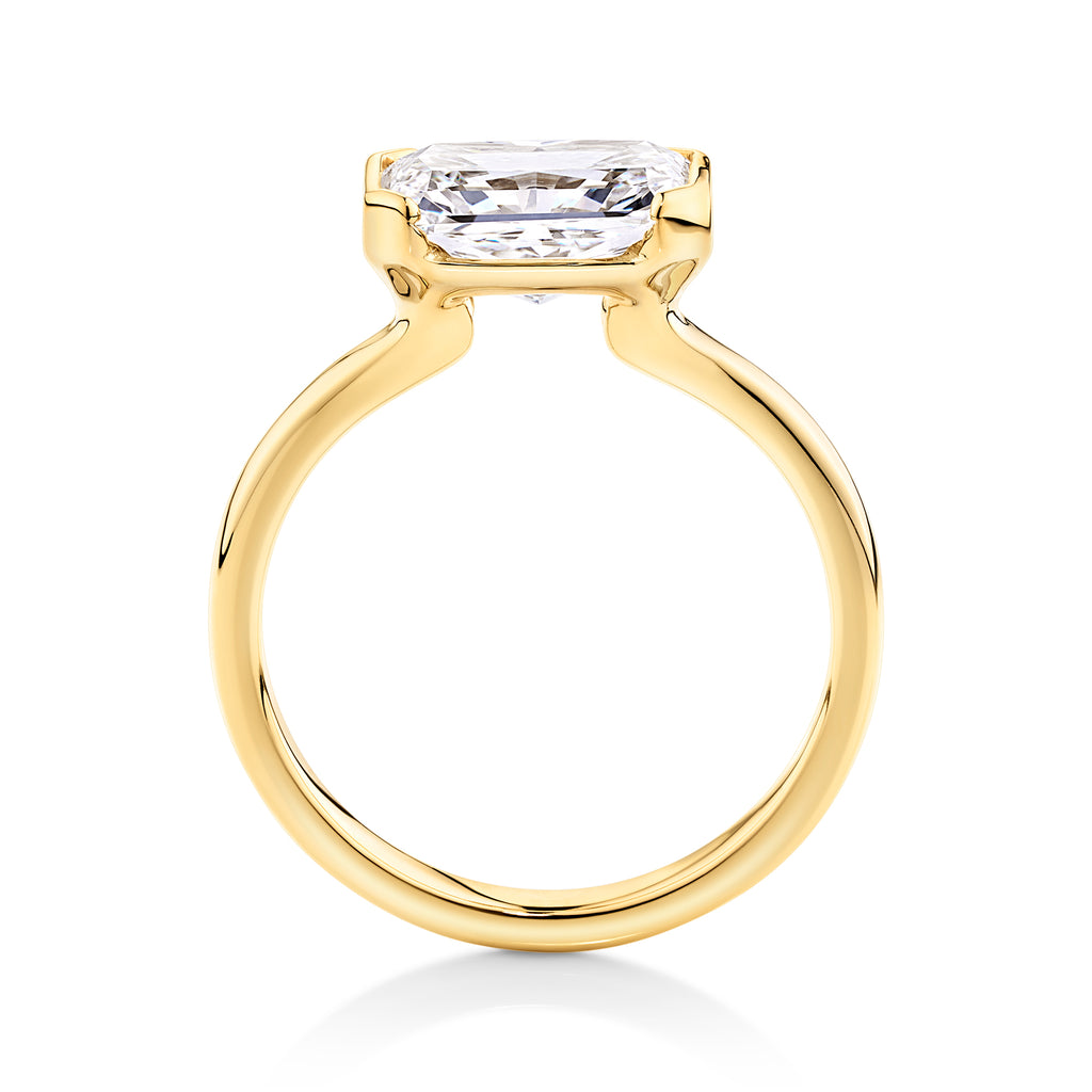 Side view yellow gold east to west set radiant cut lab grown diamond engagement ring designed at Sunshine Coast Jewellers, Morgan & Co