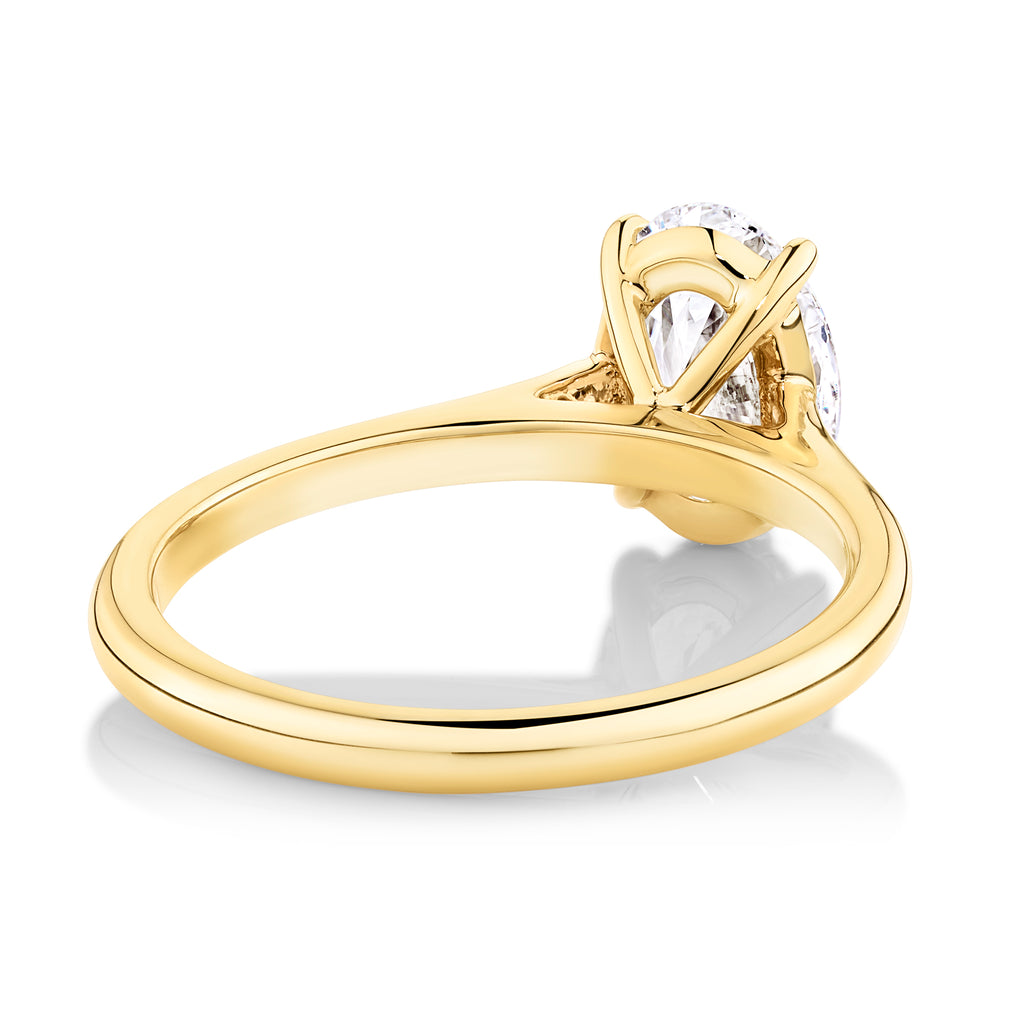 Yellow gold engagement ring with cathedral shoulder setting oval cut lab grown diamond 