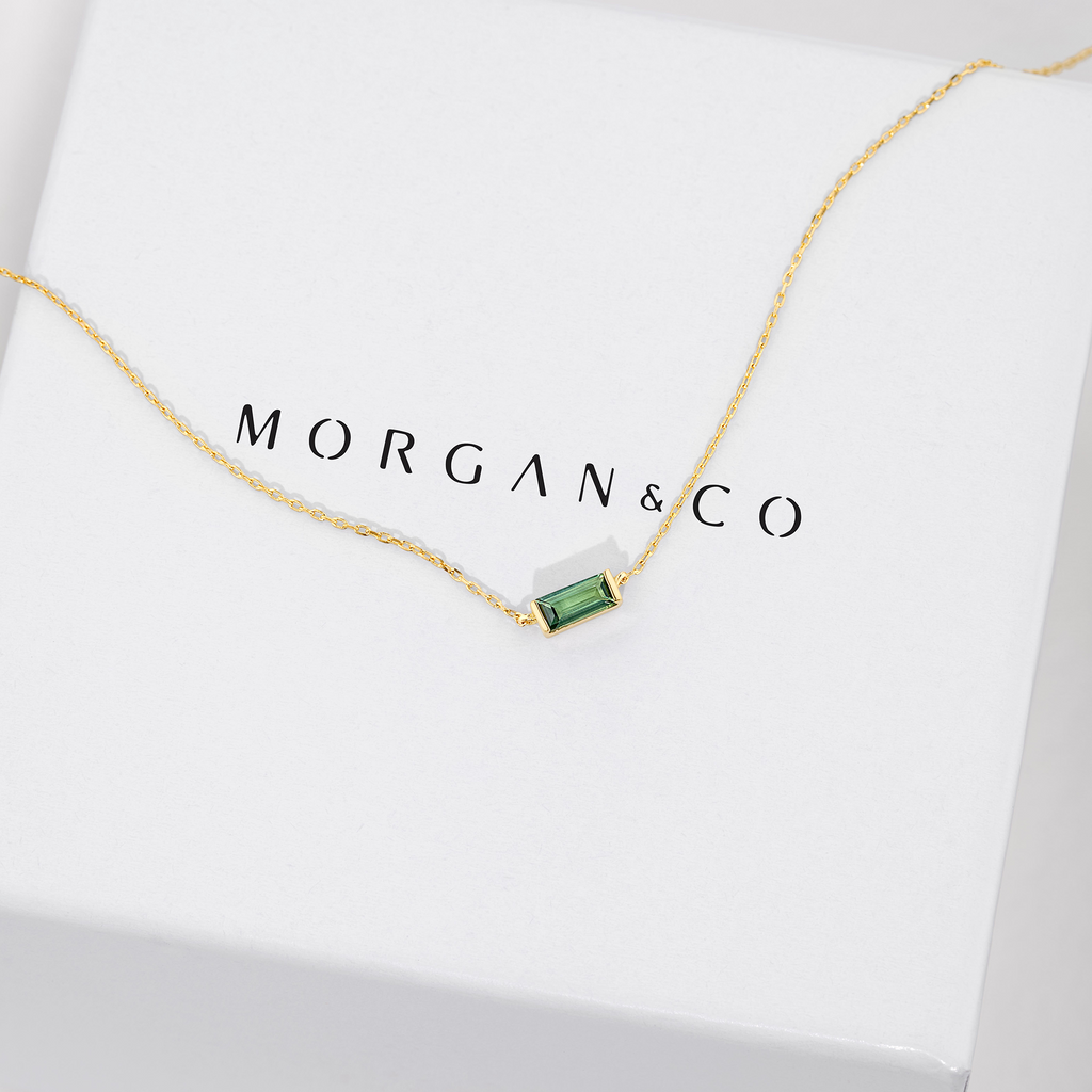 delicate yellow gold necklace with east to west set emerald cut tourmaline. sunshine coast jewellery for valentine's day