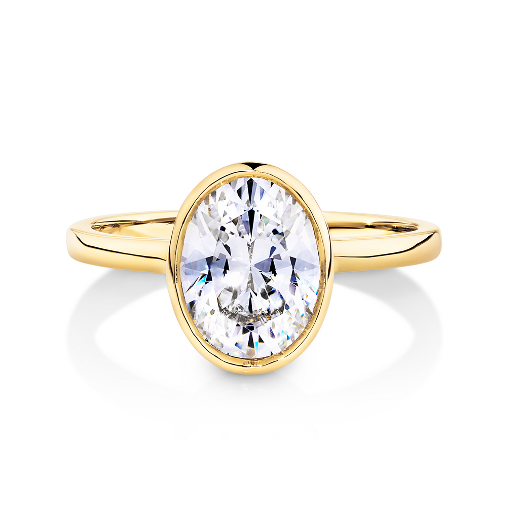 bezel set yellow gold engagement ring oval diamond 