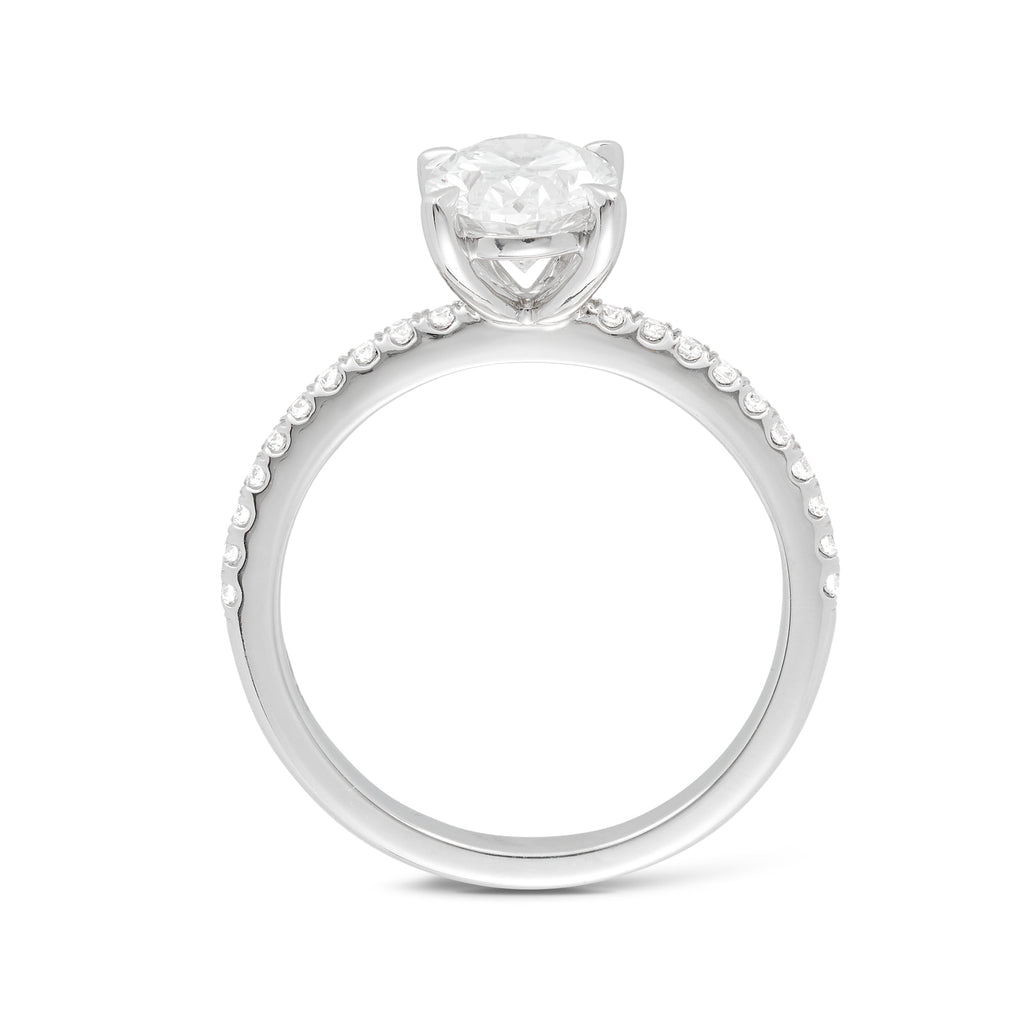 Side view of an 18ct white gold custom made engagement ring featuring a 1.50ct oval cut lab grown, cultured, diamond set in white gold petite 4 claw setting with a pave diamond band. All Australian made engagement ring. Sunshine Coast Jeweller located in Buderim for your custom made beautiful engagement rings