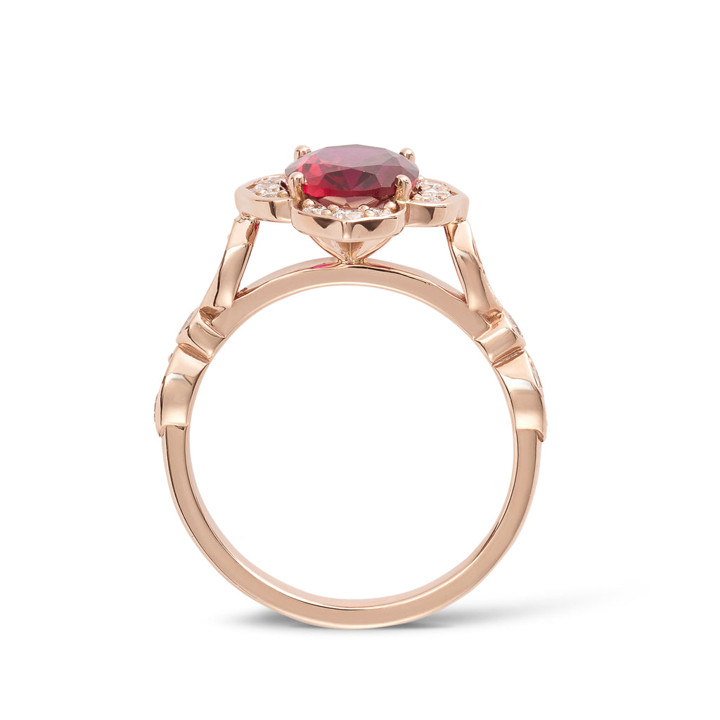 Side View - 14ct rose gold custom made ruby flower engagement ring featuring an oval cut red ruby in a flower setting with lab grown round diamonds and a diamond band. This is a unique vintage inspired engagement ring with a coloured stone. Our rings are designed at our Sunshine Coast Jeweller located in Buderim and are All Australian made, beautiful, engagement rings.
